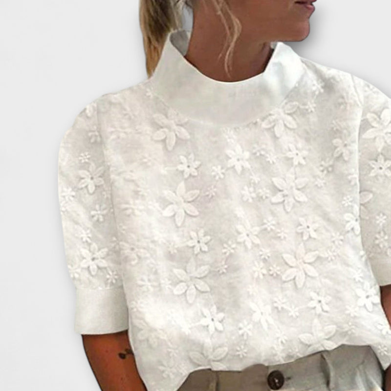 Blusa con collo alto semplice ricamato