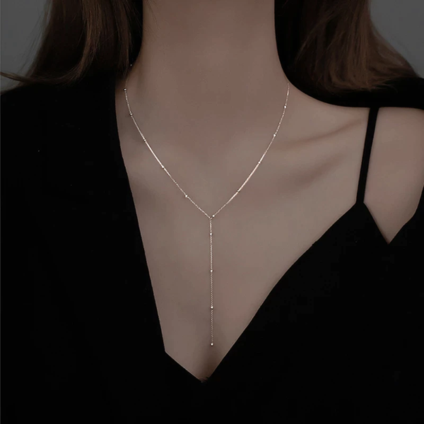 Collana a clavicola con frange