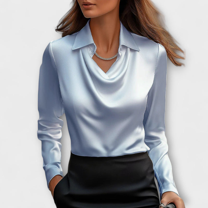 Blusa brillante con colletto arricciato